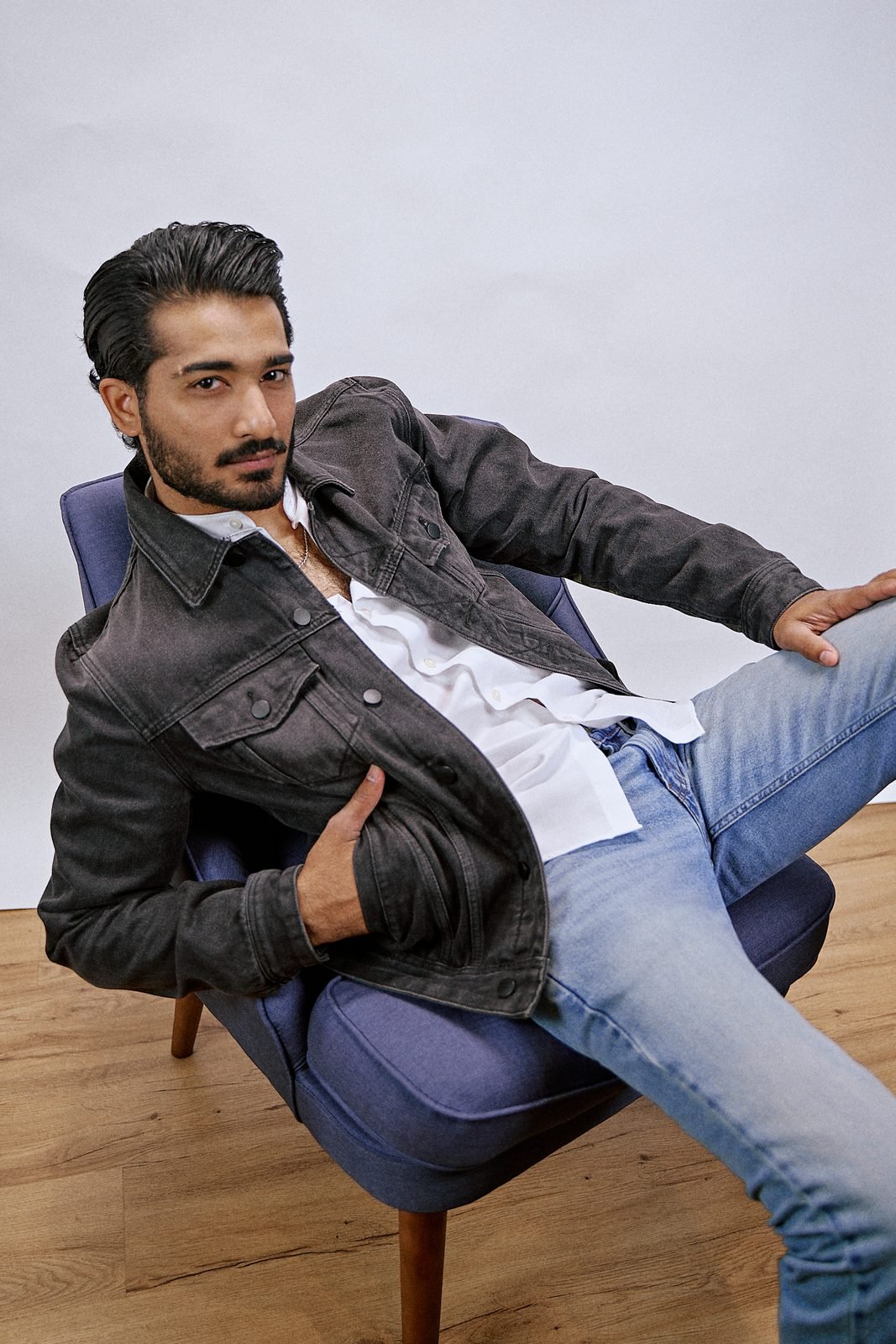 Grey denim jacket, blue chair