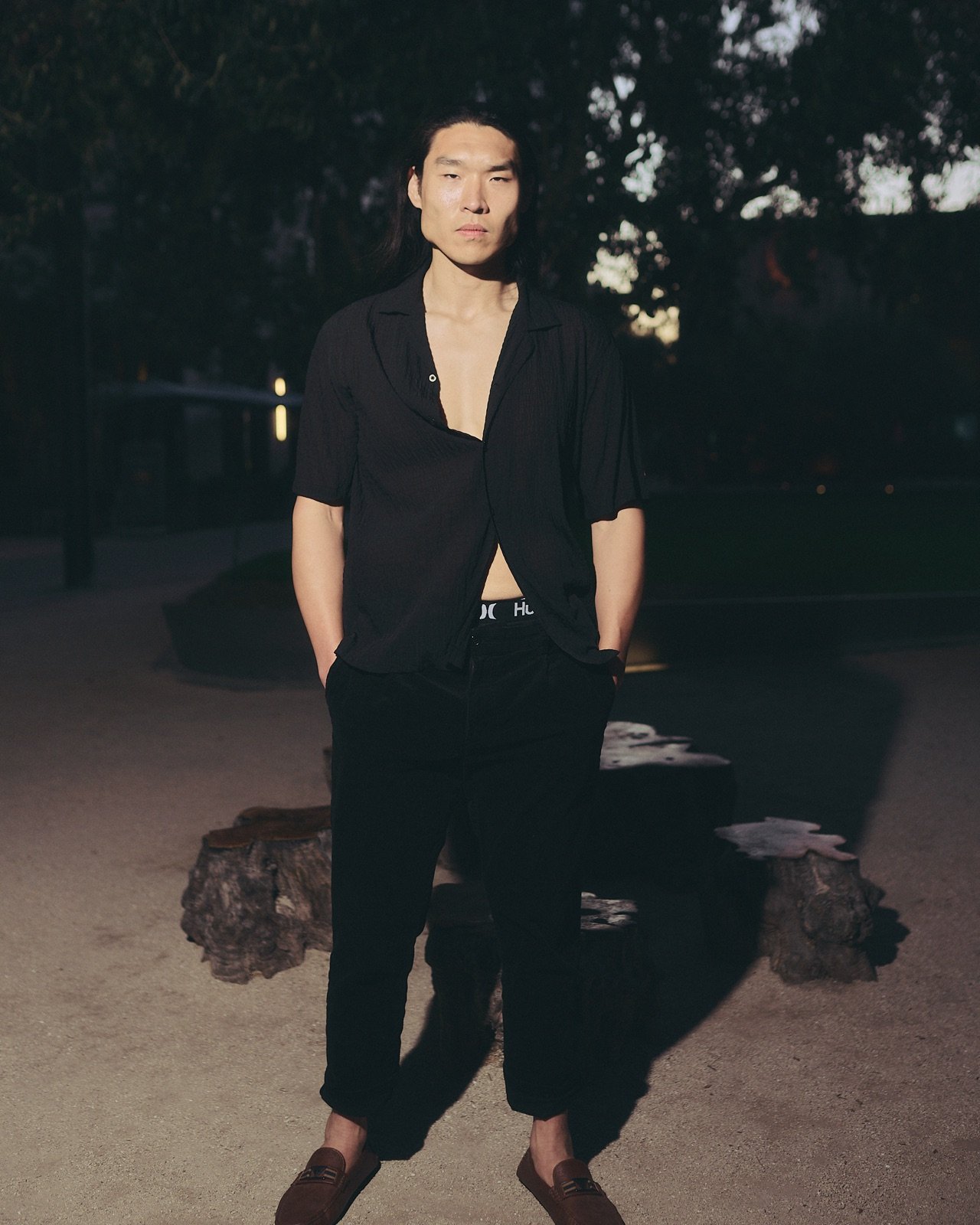 Black shirt, standing in the last light