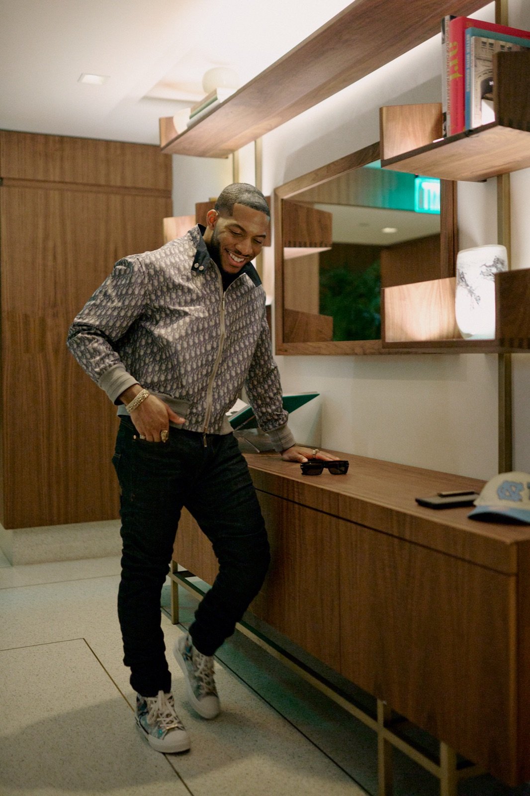 Patterned jacket, leaning on a sideboard