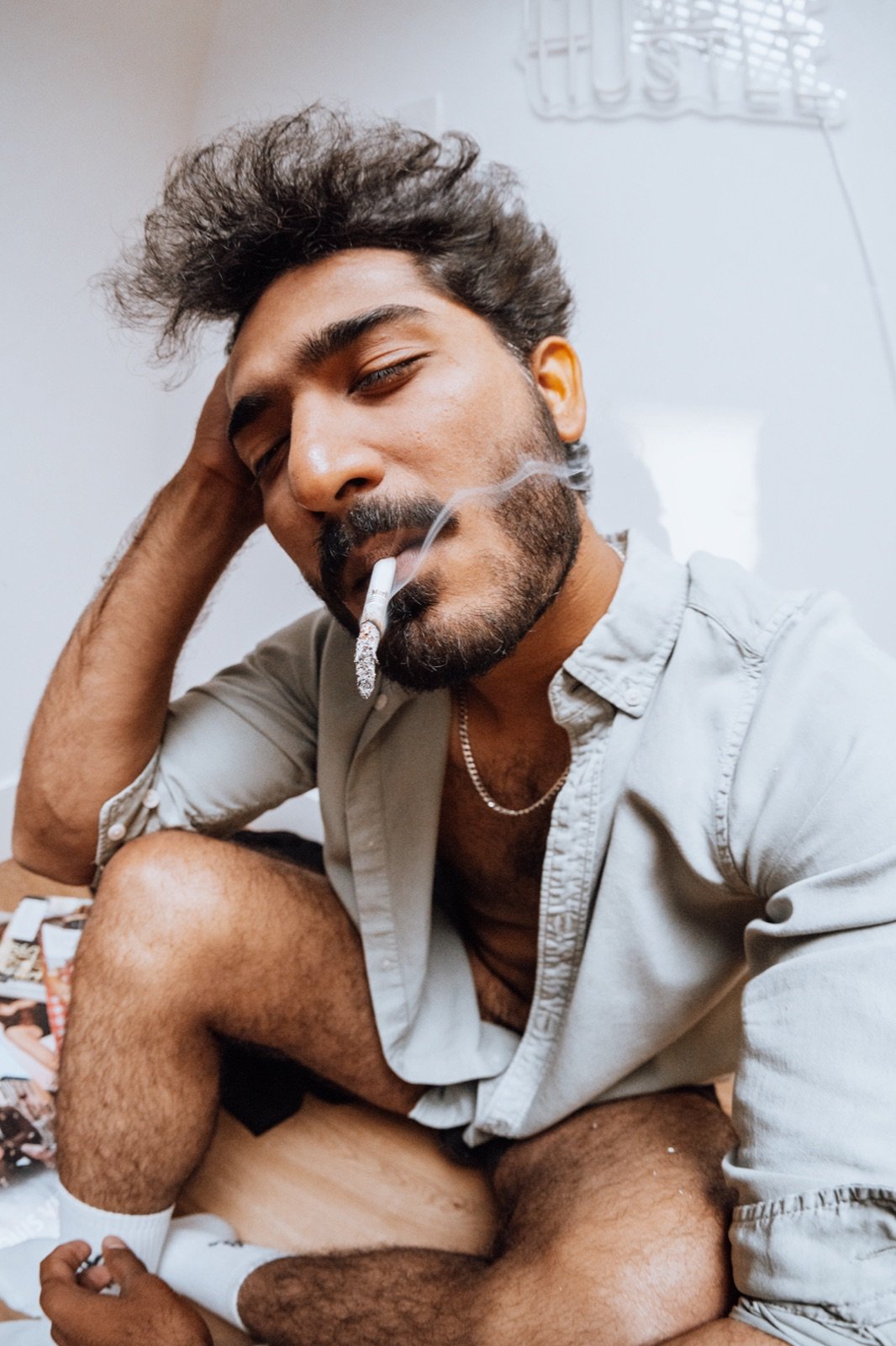 Cigarette, hand in the hair