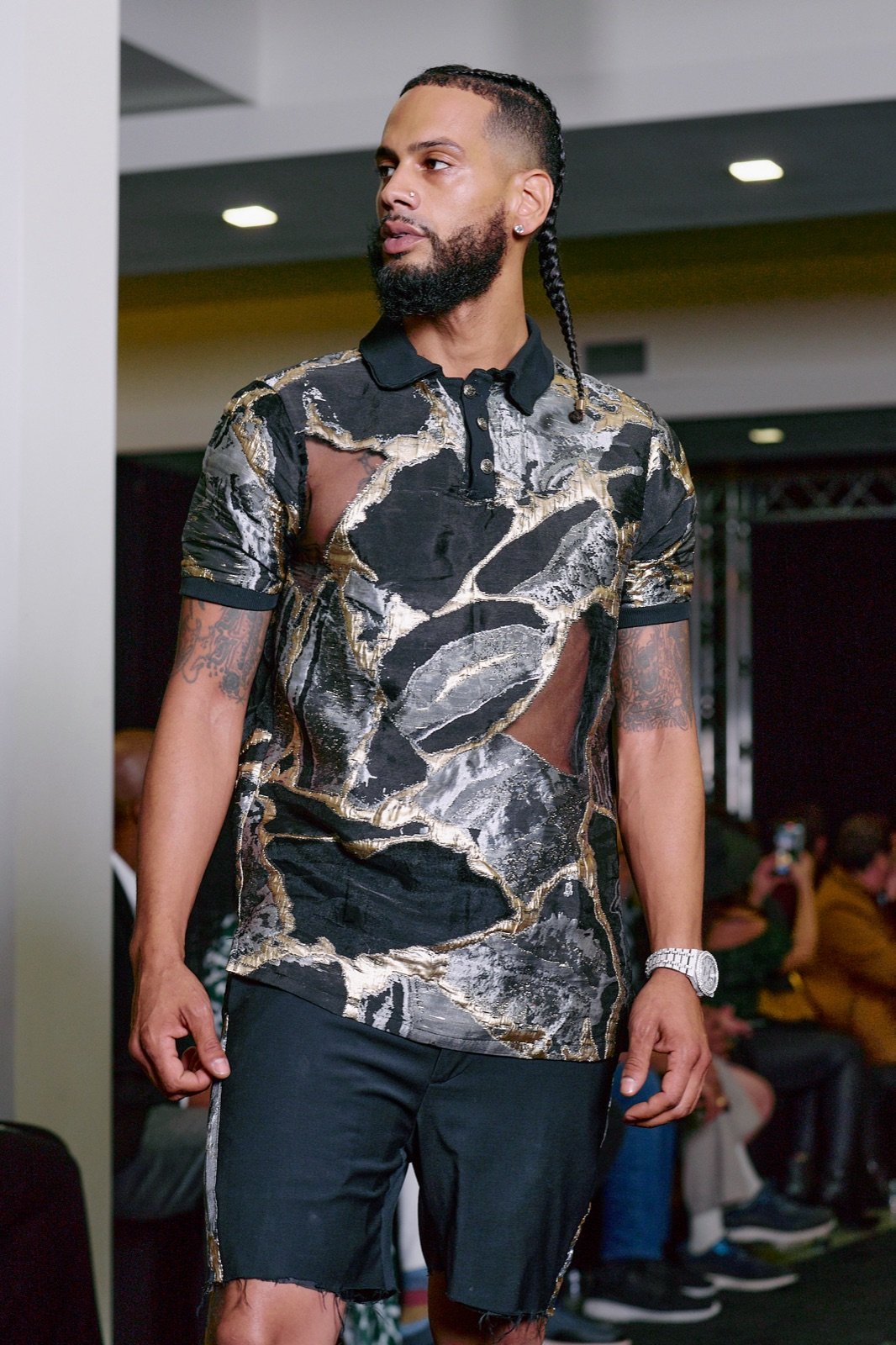 Marbled print shirt and black shorts