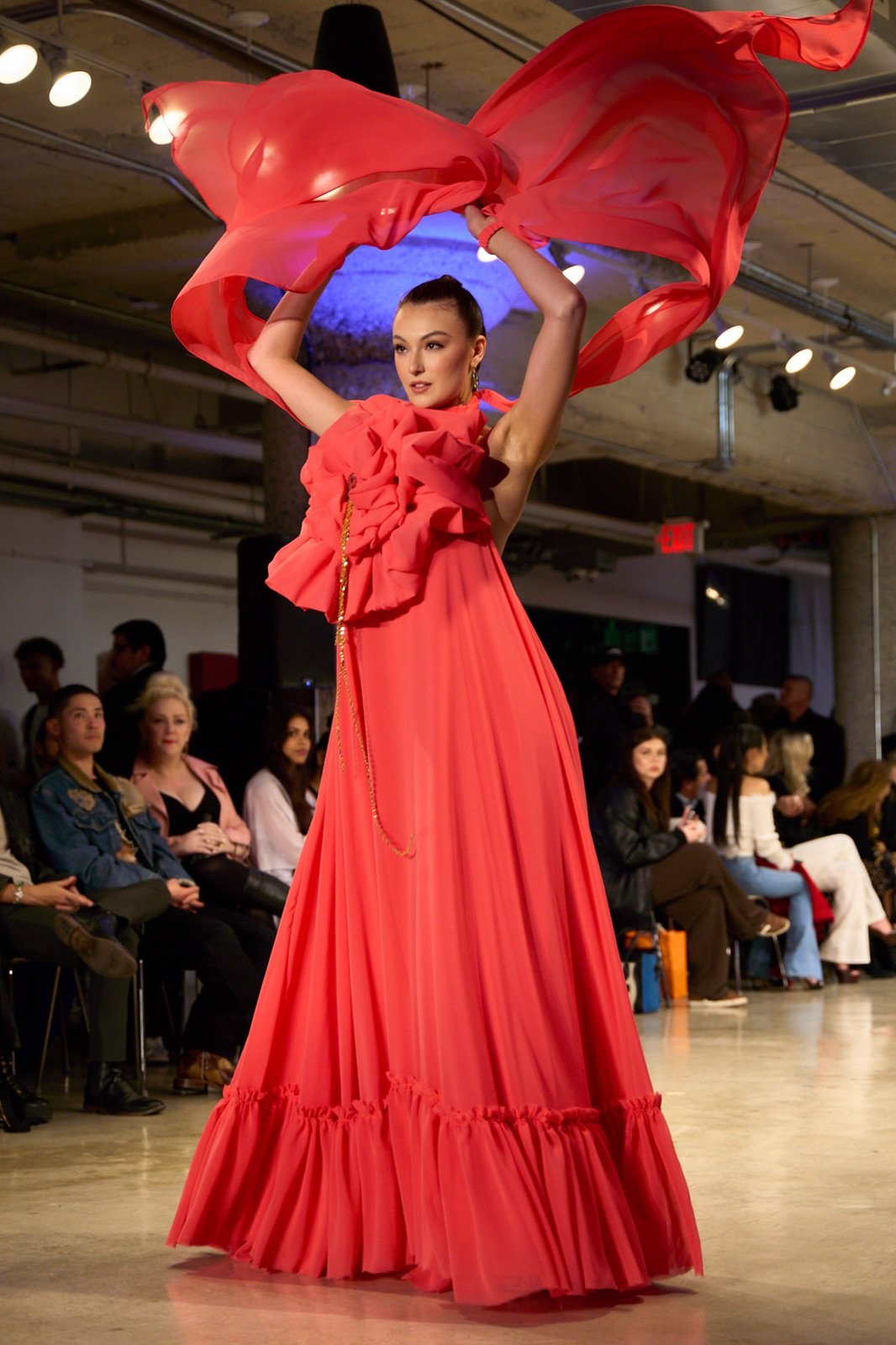Red ruffled gown with a flying scarf