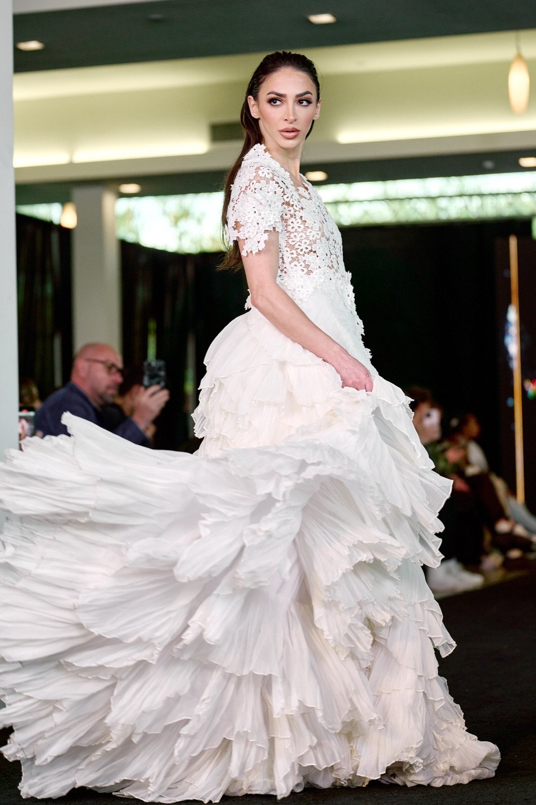 White lace and ruffle gown, twirling